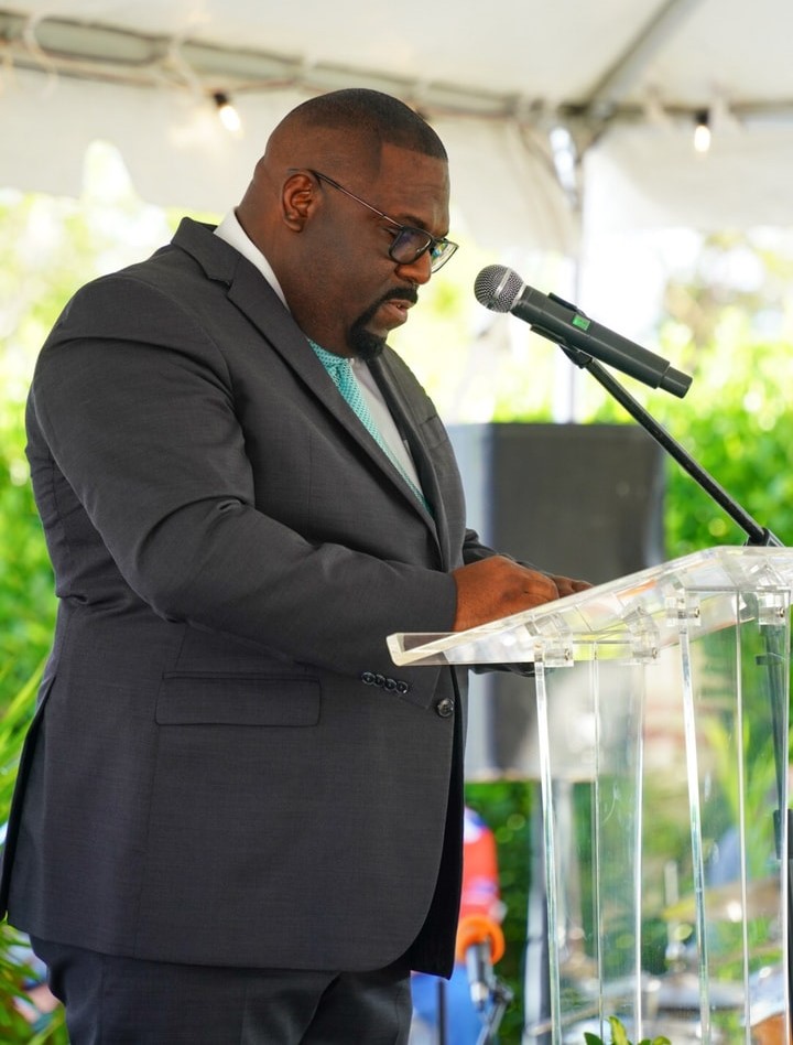 Hon. Minister Dwayne Seymour gives a speech at a podium