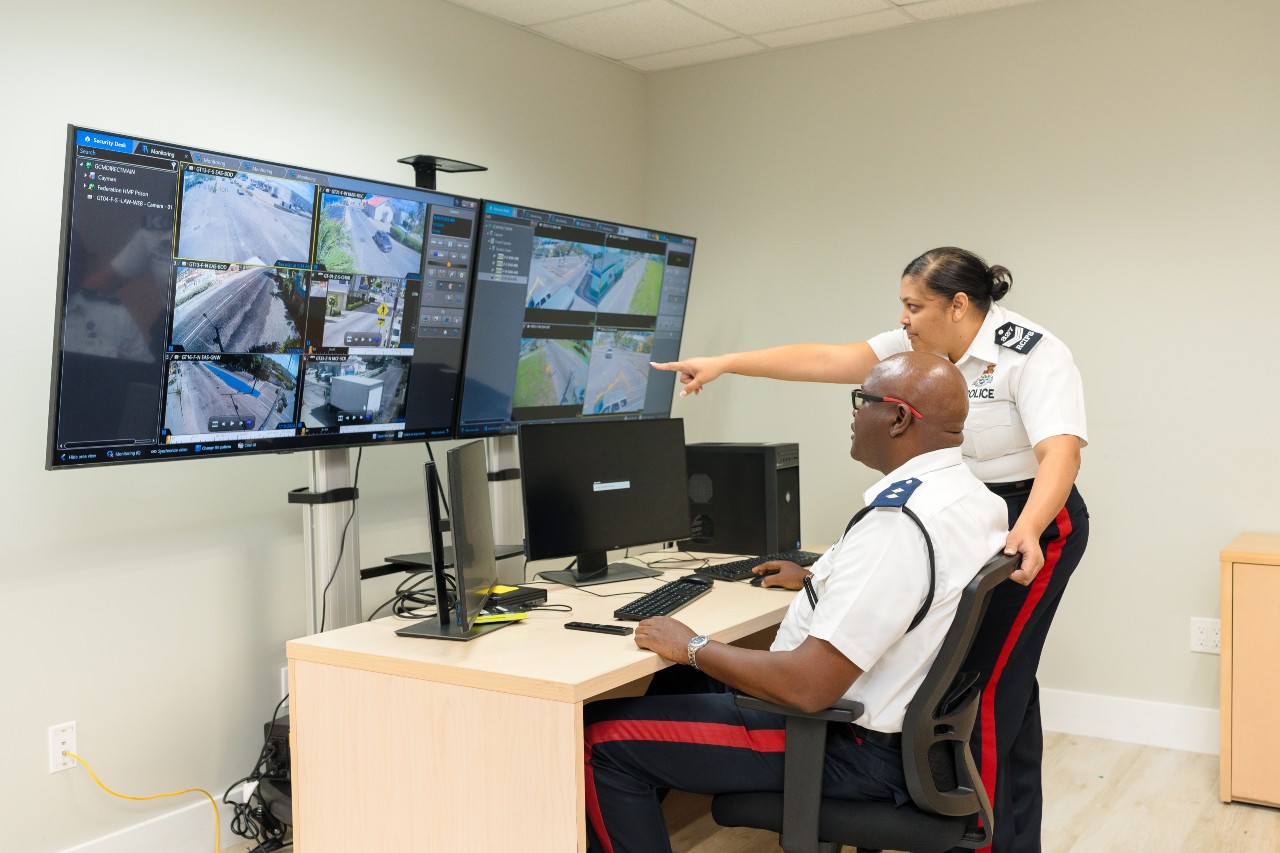 Royal Cayman Islands Police Service Officers Check Cameras